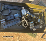 Ammo can with assorted scope rings and mount