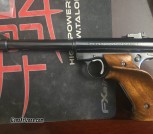 Ruger Mk I Target 6 7/8 with muzzle brake and Herrett Grips.
