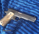Springfield 1911 in 45acp w/match barrel and stag grips